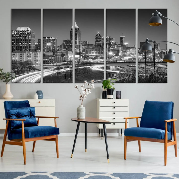 The living room is highlighted by an Atlanta Black and White Wall Art Cityscape Canvas Print that complements the black-and-white cityscape triptych on the wall, bringing an urban decor vibe to the space.