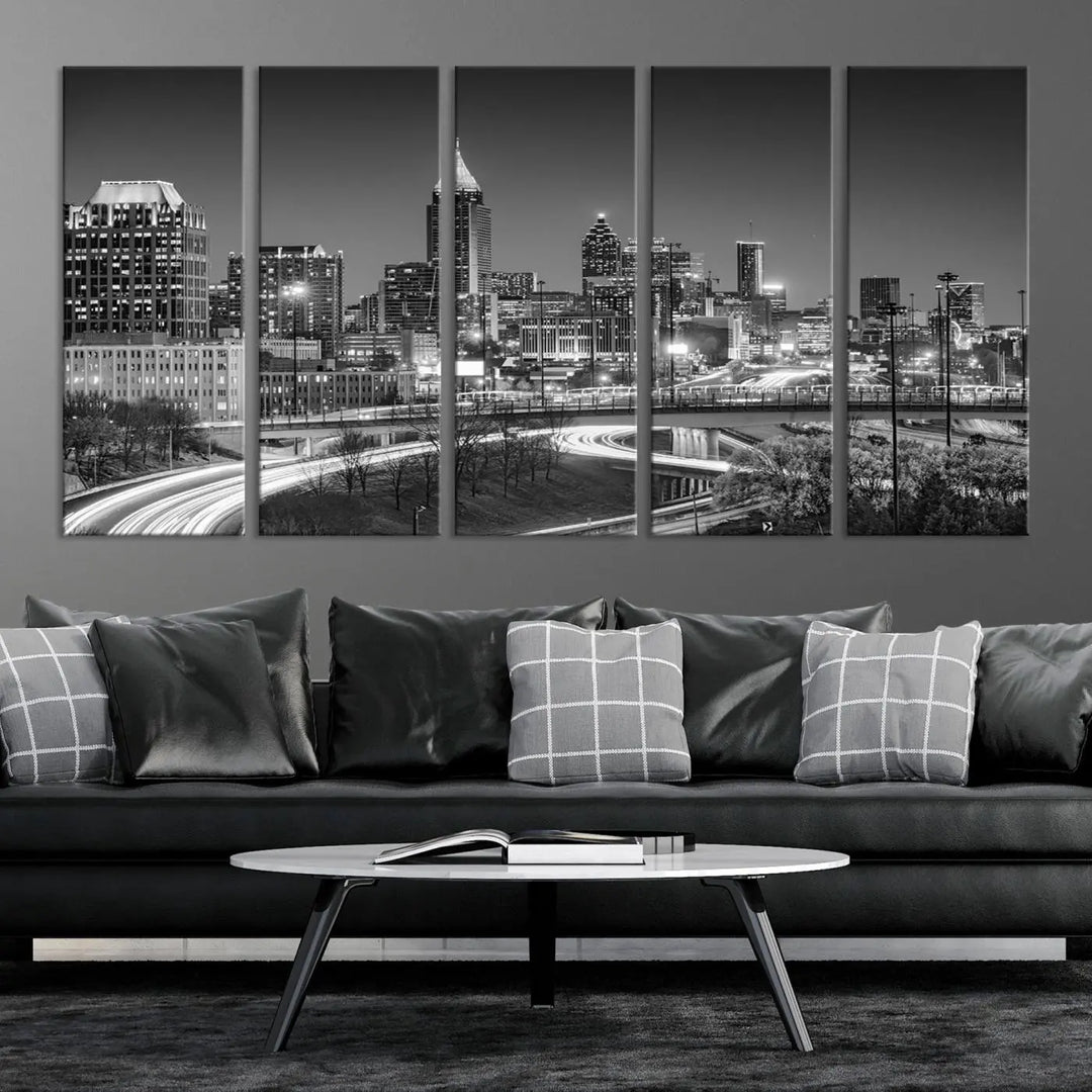 The living room is highlighted by an Atlanta Black and White Wall Art Cityscape Canvas Print that complements the black-and-white cityscape triptych on the wall, bringing an urban decor vibe to the space.