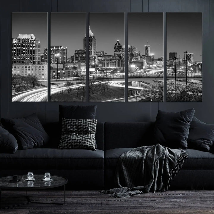 The living room is highlighted by an Atlanta Black and White Wall Art Cityscape Canvas Print that complements the black-and-white cityscape triptych on the wall, bringing an urban decor vibe to the space.