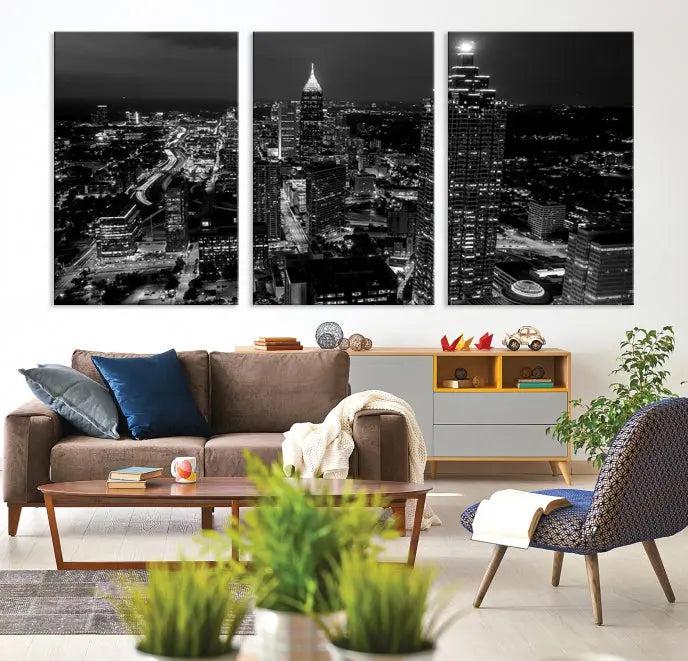 The contemporary living room features the "Atlanta Building Skyline Black and White Wall Art Cityscape Canvas Print" on the wall, designed as a gallery-wrapped museum-quality canvas for lasting elegance.