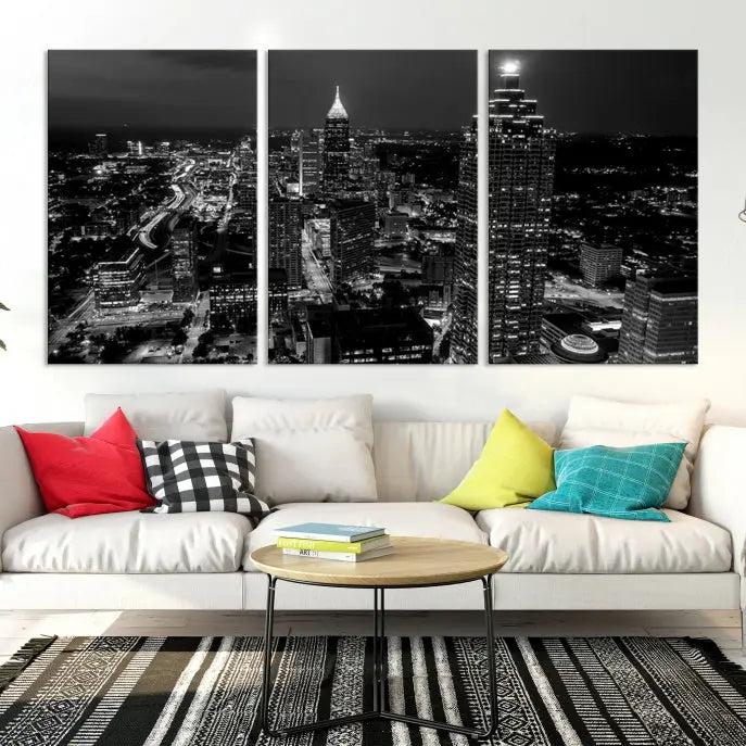 The contemporary living room features the "Atlanta Building Skyline Black and White Wall Art Cityscape Canvas Print" on the wall, designed as a gallery-wrapped museum-quality canvas for lasting elegance.