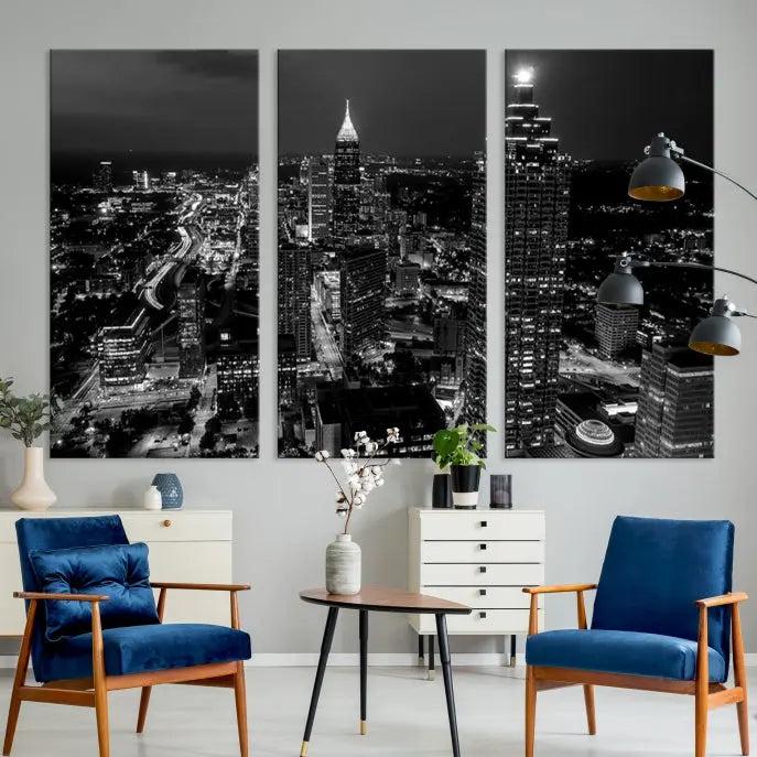 The contemporary living room features the "Atlanta Building Skyline Black and White Wall Art Cityscape Canvas Print" on the wall, designed as a gallery-wrapped museum-quality canvas for lasting elegance.