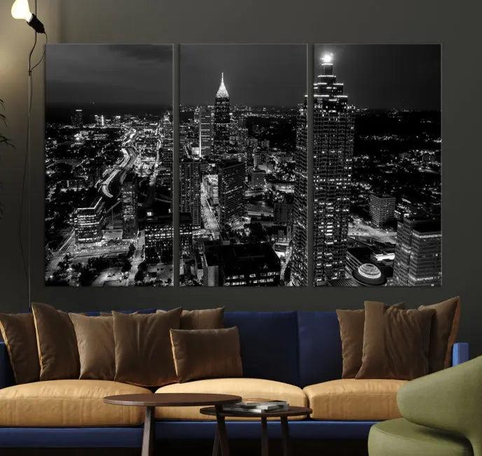 The contemporary living room features the "Atlanta Building Skyline Black and White Wall Art Cityscape Canvas Print" on the wall, designed as a gallery-wrapped museum-quality canvas for lasting elegance.