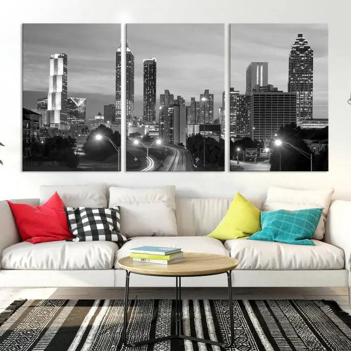 The contemporary living room showcases the Atlanta City Black and White Wall Art triptych on the wall.