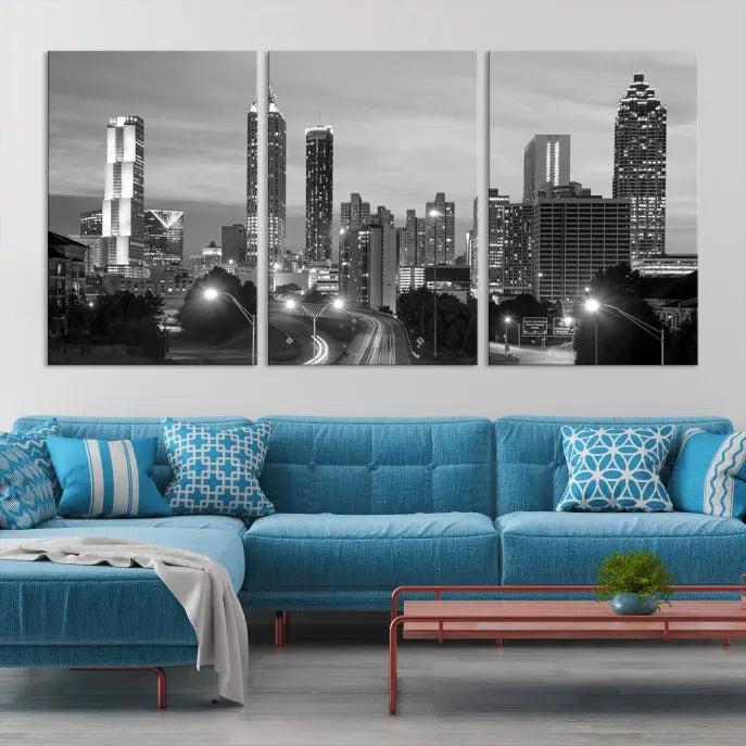 The contemporary living room showcases the Atlanta City Black and White Wall Art triptych on the wall.