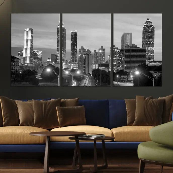 The contemporary living room showcases the Atlanta City Black and White Wall Art triptych on the wall.