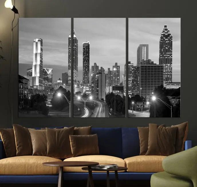 The contemporary living room showcases the Atlanta City Black and White Wall Art triptych on the wall.