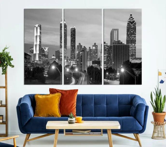 The contemporary living room showcases the Atlanta City Black and White Wall Art triptych on the wall.