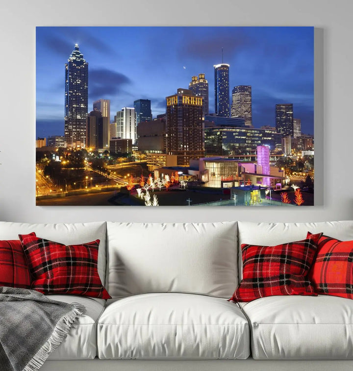 The Atlanta City Canvas Print adorns the wall, showcasing the cityscape of illuminated skyscrapers at dusk on a gallery-wrapped museum-quality canvas.