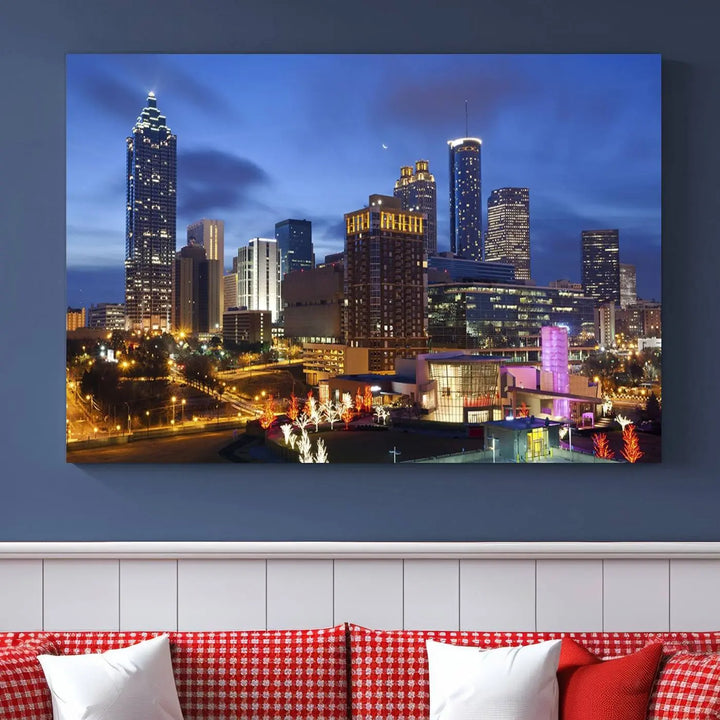 The Atlanta City Canvas Print adorns the wall, showcasing the cityscape of illuminated skyscrapers at dusk on a gallery-wrapped museum-quality canvas.