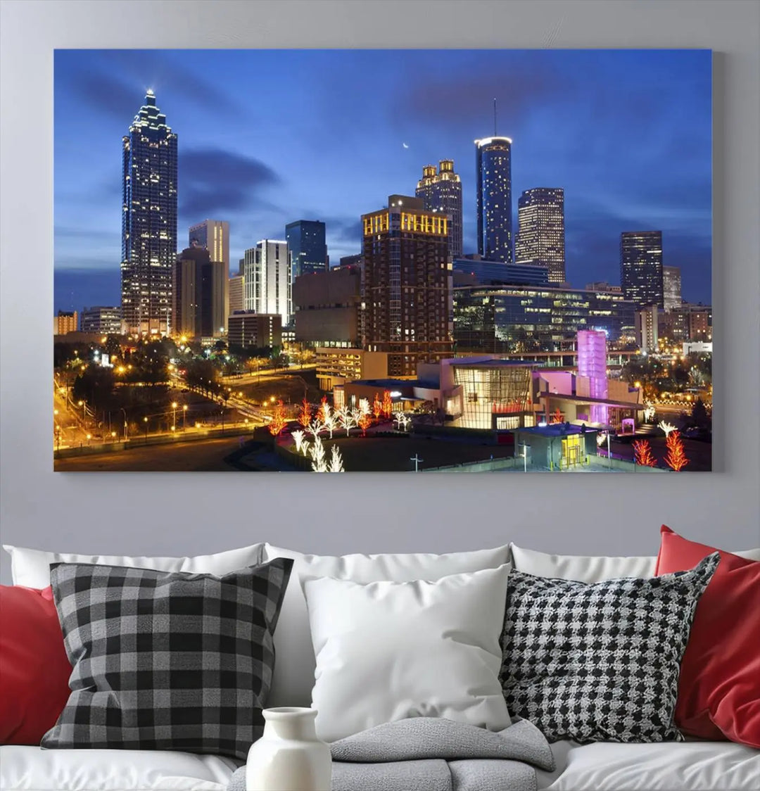 The Atlanta City Canvas Print adorns the wall, showcasing the cityscape of illuminated skyscrapers at dusk on a gallery-wrapped museum-quality canvas.