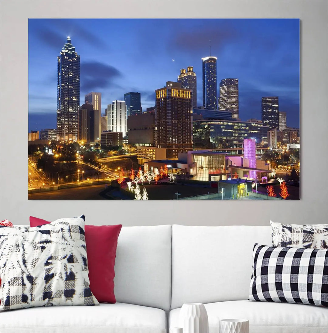 The Atlanta City Canvas Print adorns the wall, showcasing the cityscape of illuminated skyscrapers at dusk on a gallery-wrapped museum-quality canvas.