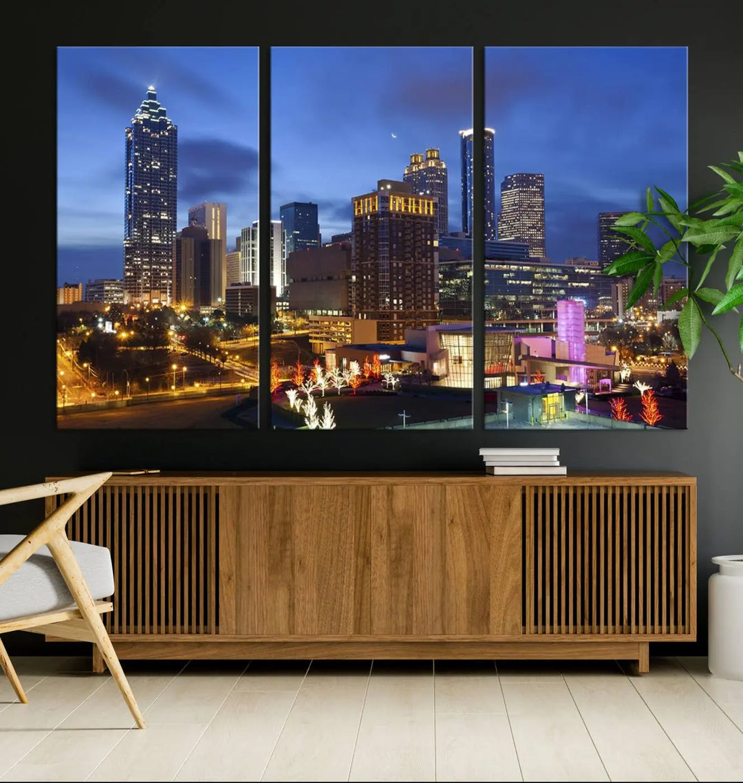 The Atlanta City Canvas Print adorns the wall, showcasing the cityscape of illuminated skyscrapers at dusk on a gallery-wrapped museum-quality canvas.