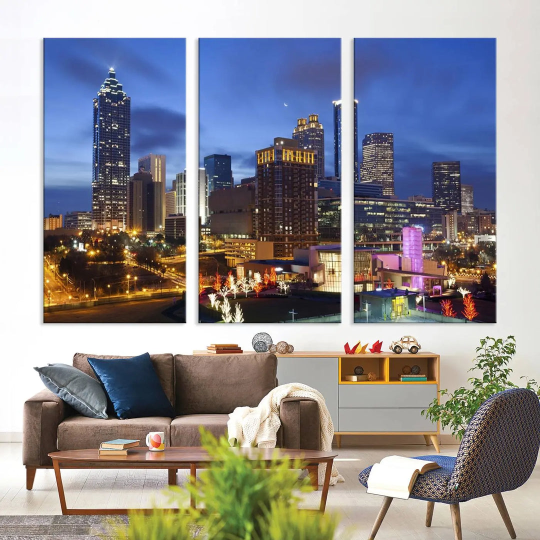 The Atlanta City Canvas Print adorns the wall, showcasing the cityscape of illuminated skyscrapers at dusk on a gallery-wrapped museum-quality canvas.