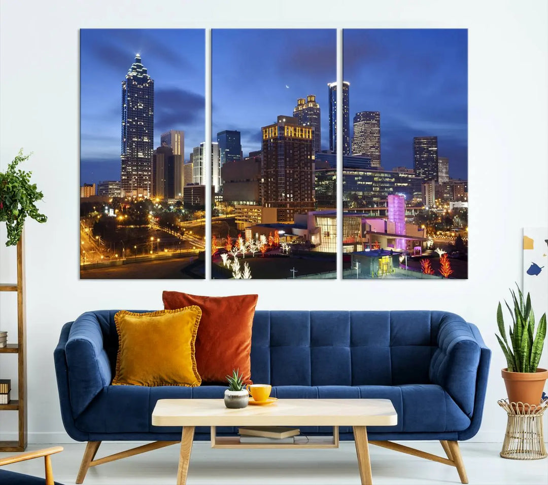 The Atlanta City Canvas Print adorns the wall, showcasing the cityscape of illuminated skyscrapers at dusk on a gallery-wrapped museum-quality canvas.