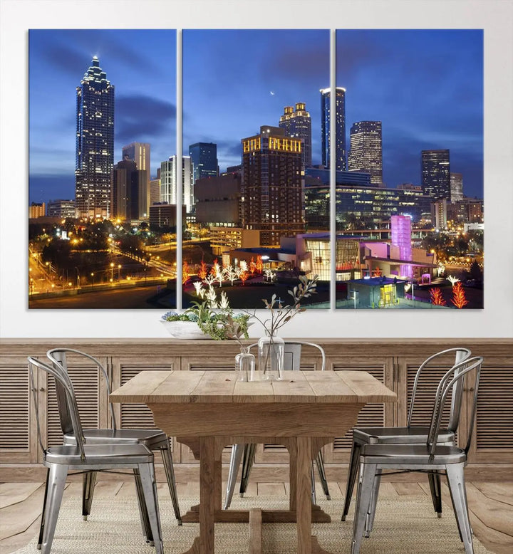 The Atlanta City Canvas Print adorns the wall, showcasing the cityscape of illuminated skyscrapers at dusk on a gallery-wrapped museum-quality canvas.