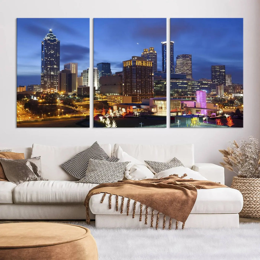 The Atlanta City Canvas Print adorns the wall, showcasing the cityscape of illuminated skyscrapers at dusk on a gallery-wrapped museum-quality canvas.