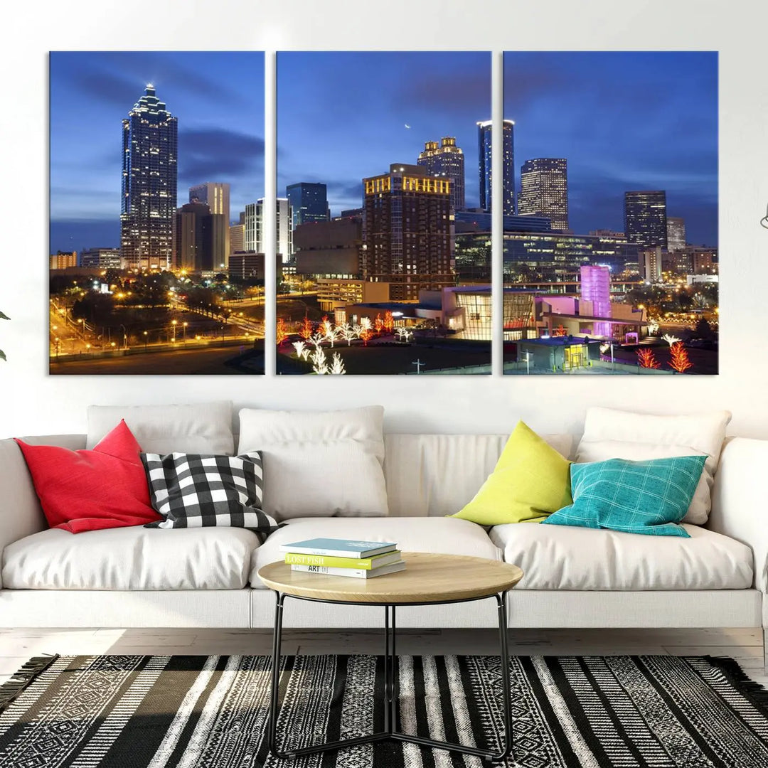 The Atlanta City Canvas Print adorns the wall, showcasing the cityscape of illuminated skyscrapers at dusk on a gallery-wrapped museum-quality canvas.