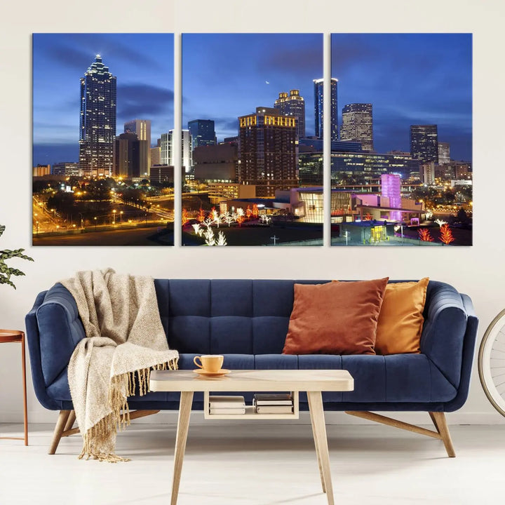 The Atlanta City Canvas Print adorns the wall, showcasing the cityscape of illuminated skyscrapers at dusk on a gallery-wrapped museum-quality canvas.