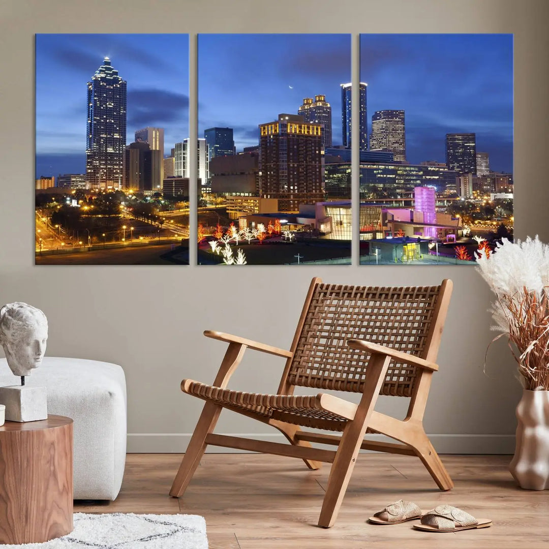 The Atlanta City Canvas Print adorns the wall, showcasing the cityscape of illuminated skyscrapers at dusk on a gallery-wrapped museum-quality canvas.