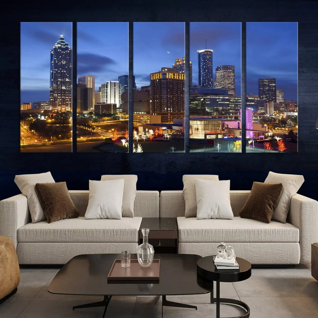 The Atlanta City Canvas Print adorns the wall, showcasing the cityscape of illuminated skyscrapers at dusk on a gallery-wrapped museum-quality canvas.