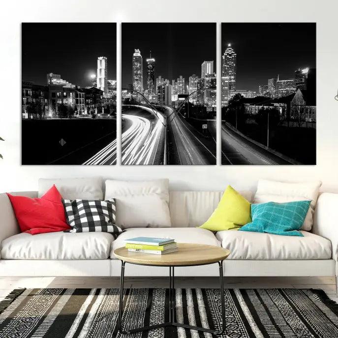 The room features an Atlanta City Lights Black and White Wall Art Cityscape Canvas Print on the wall, with the piece gallery wrapped on museum-quality canvas.