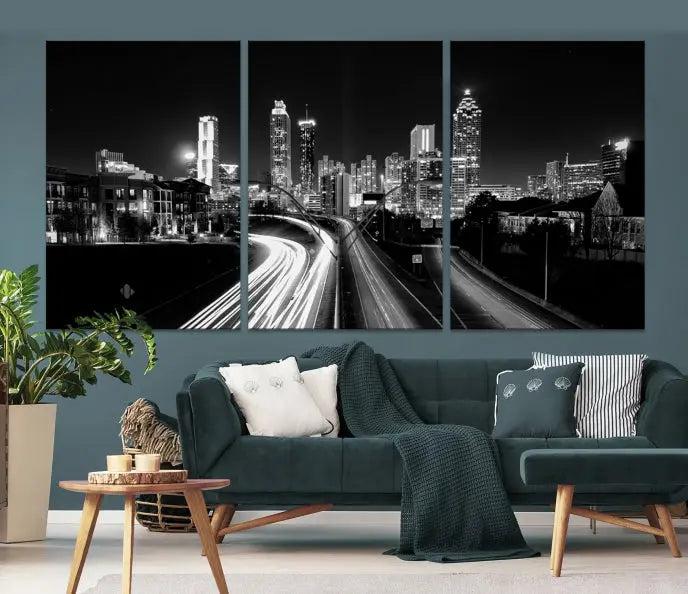 The room features an Atlanta City Lights Black and White Wall Art Cityscape Canvas Print on the wall, with the piece gallery wrapped on museum-quality canvas.