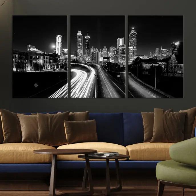 The room features an Atlanta City Lights Black and White Wall Art Cityscape Canvas Print on the wall, with the piece gallery wrapped on museum-quality canvas.