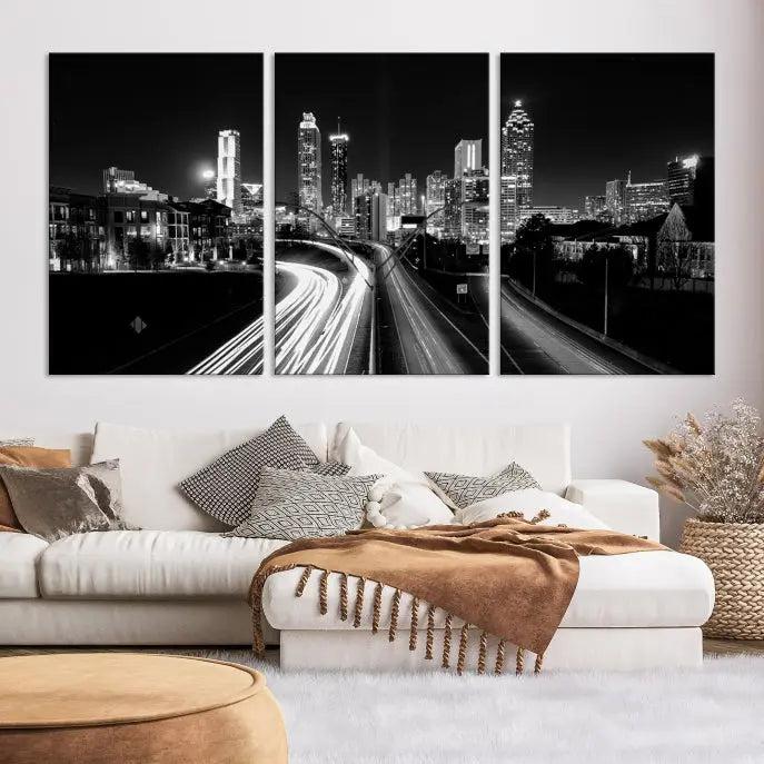 The room features an Atlanta City Lights Black and White Wall Art Cityscape Canvas Print on the wall, with the piece gallery wrapped on museum-quality canvas.