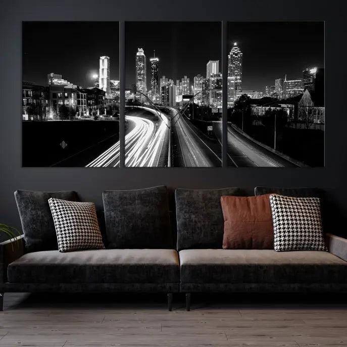 The room features an Atlanta City Lights Black and White Wall Art Cityscape Canvas Print on the wall, with the piece gallery wrapped on museum-quality canvas.