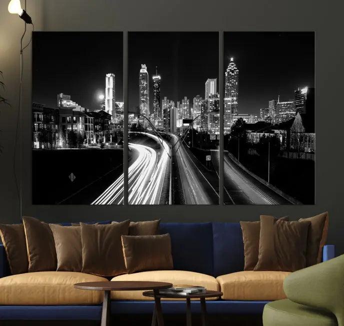 The room features an Atlanta City Lights Black and White Wall Art Cityscape Canvas Print on the wall, with the piece gallery wrapped on museum-quality canvas.