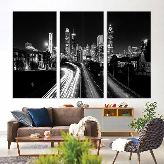 The room features an Atlanta City Lights Black and White Wall Art Cityscape Canvas Print on the wall, with the piece gallery wrapped on museum-quality canvas.