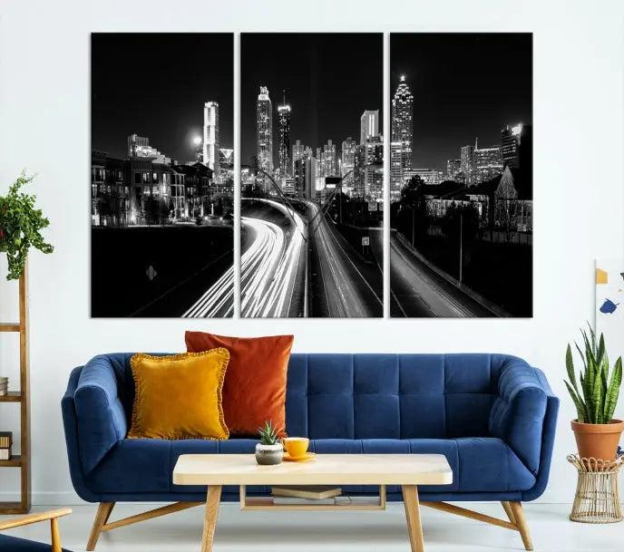 The room features an Atlanta City Lights Black and White Wall Art Cityscape Canvas Print on the wall, with the piece gallery wrapped on museum-quality canvas.