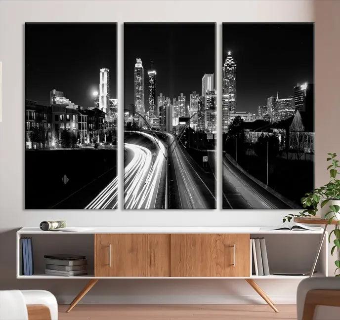 The room features an Atlanta City Lights Black and White Wall Art Cityscape Canvas Print on the wall, with the piece gallery wrapped on museum-quality canvas.