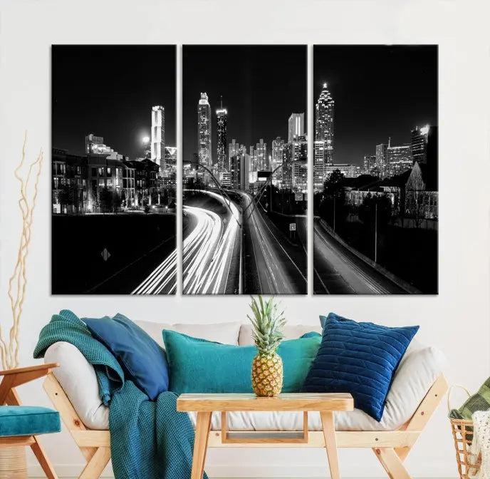 The room features an Atlanta City Lights Black and White Wall Art Cityscape Canvas Print on the wall, with the piece gallery wrapped on museum-quality canvas.