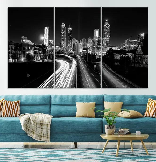 The room features an Atlanta City Lights Black and White Wall Art Cityscape Canvas Print on the wall, with the piece gallery wrapped on museum-quality canvas.