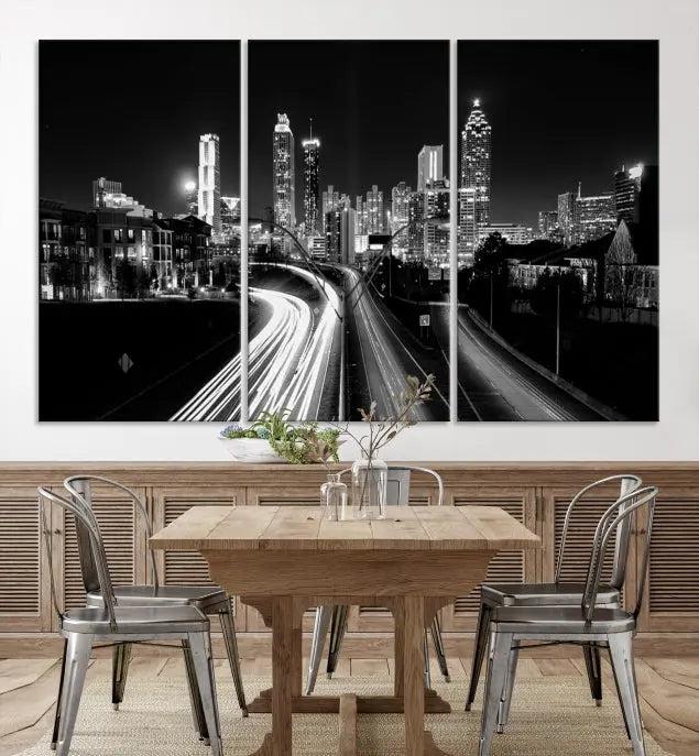 The room features an Atlanta City Lights Black and White Wall Art Cityscape Canvas Print on the wall, with the piece gallery wrapped on museum-quality canvas.