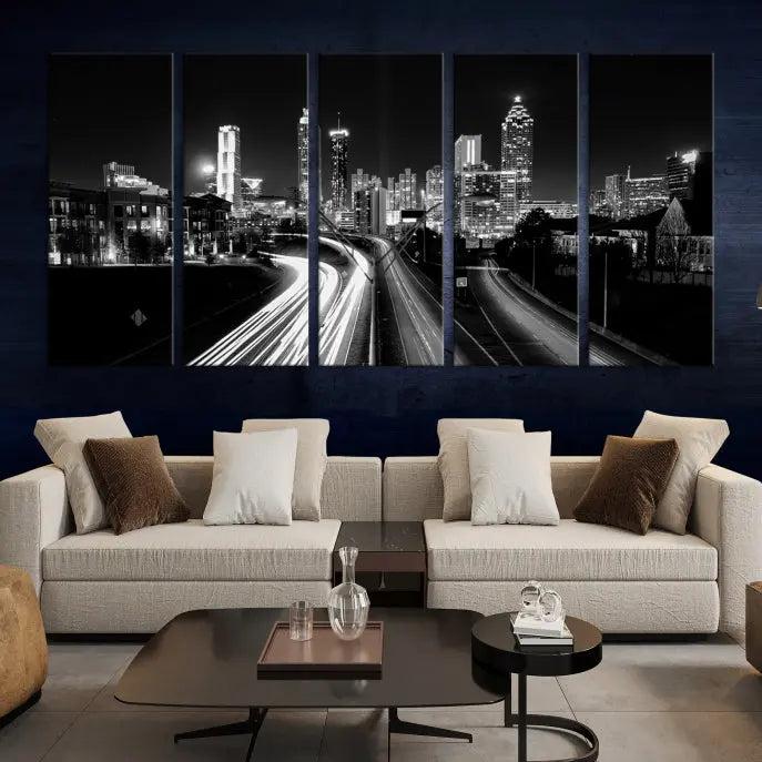 The room features an Atlanta City Lights Black and White Wall Art Cityscape Canvas Print on the wall, with the piece gallery wrapped on museum-quality canvas.