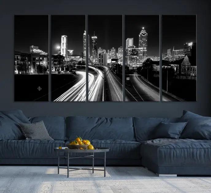 The room features an Atlanta City Lights Black and White Wall Art Cityscape Canvas Print on the wall, with the piece gallery wrapped on museum-quality canvas.