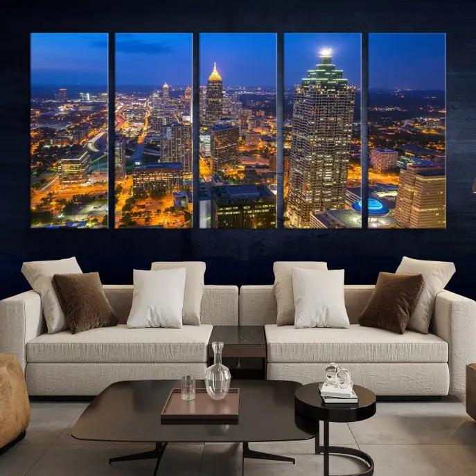 The room features three stunning pieces of the "Atlanta City Lights Cityscape View" wall art canvas prints, showcasing a lit-up city skyline adorned on the wall.