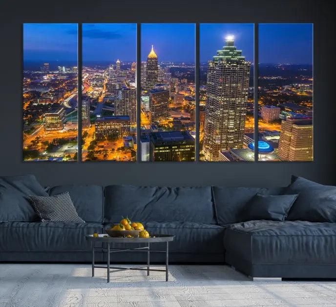 The room features three stunning pieces of the "Atlanta City Lights Cityscape View" wall art canvas prints, showcasing a lit-up city skyline adorned on the wall.