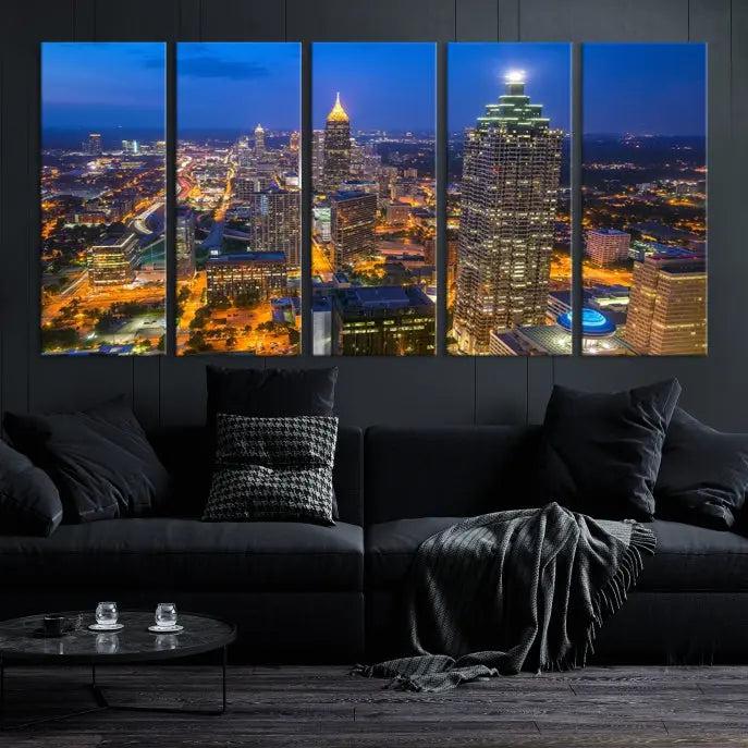 The room features three stunning pieces of the "Atlanta City Lights Cityscape View" wall art canvas prints, showcasing a lit-up city skyline adorned on the wall.