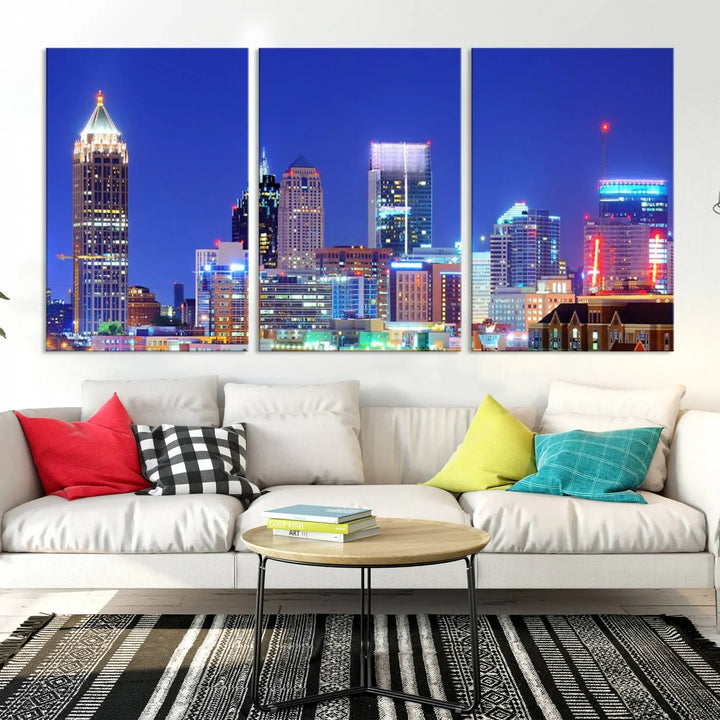 The modern living room is enhanced by the elegance of the "Atlanta City Lights Night Blue Skyline Cityscape Wall Art Canvas Print." This triptych, crafted on museum-quality canvas with a UV-protective coating, arrives ready to hang on the wall.