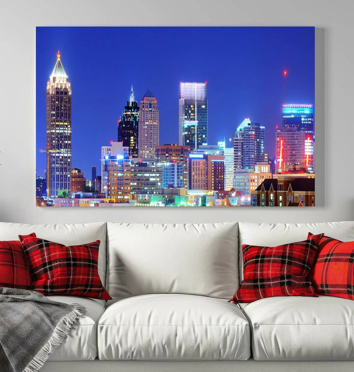 The modern living room is enhanced by the elegance of the "Atlanta City Lights Night Blue Skyline Cityscape Wall Art Canvas Print." This triptych, crafted on museum-quality canvas with a UV-protective coating, arrives ready to hang on the wall.