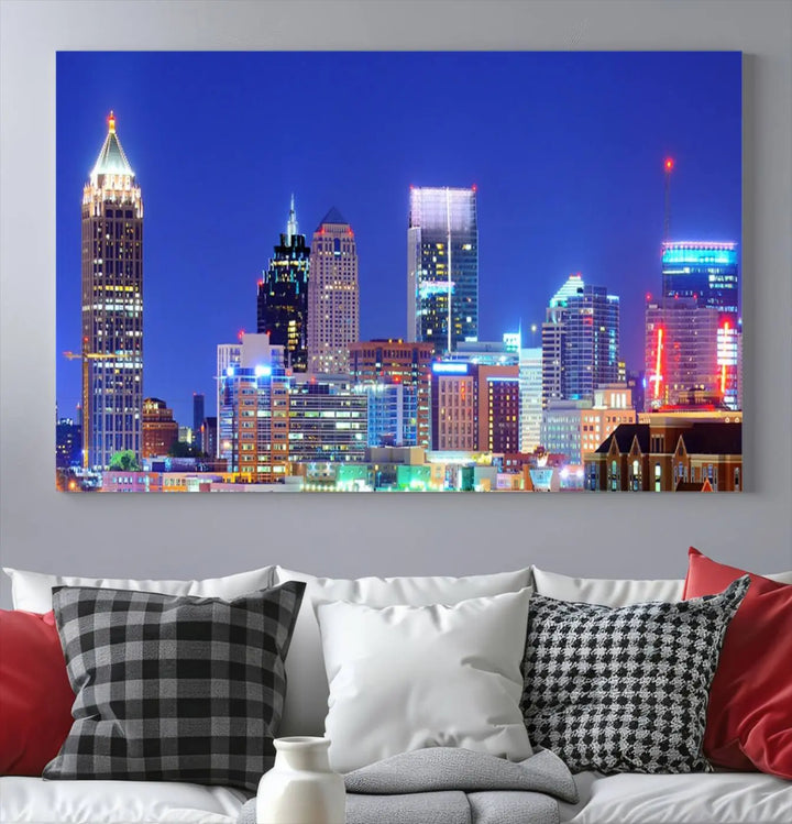 The modern living room is enhanced by the elegance of the "Atlanta City Lights Night Blue Skyline Cityscape Wall Art Canvas Print." This triptych, crafted on museum-quality canvas with a UV-protective coating, arrives ready to hang on the wall.