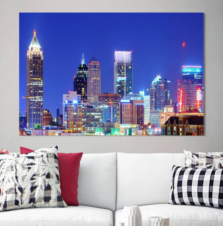 The modern living room is enhanced by the elegance of the "Atlanta City Lights Night Blue Skyline Cityscape Wall Art Canvas Print." This triptych, crafted on museum-quality canvas with a UV-protective coating, arrives ready to hang on the wall.