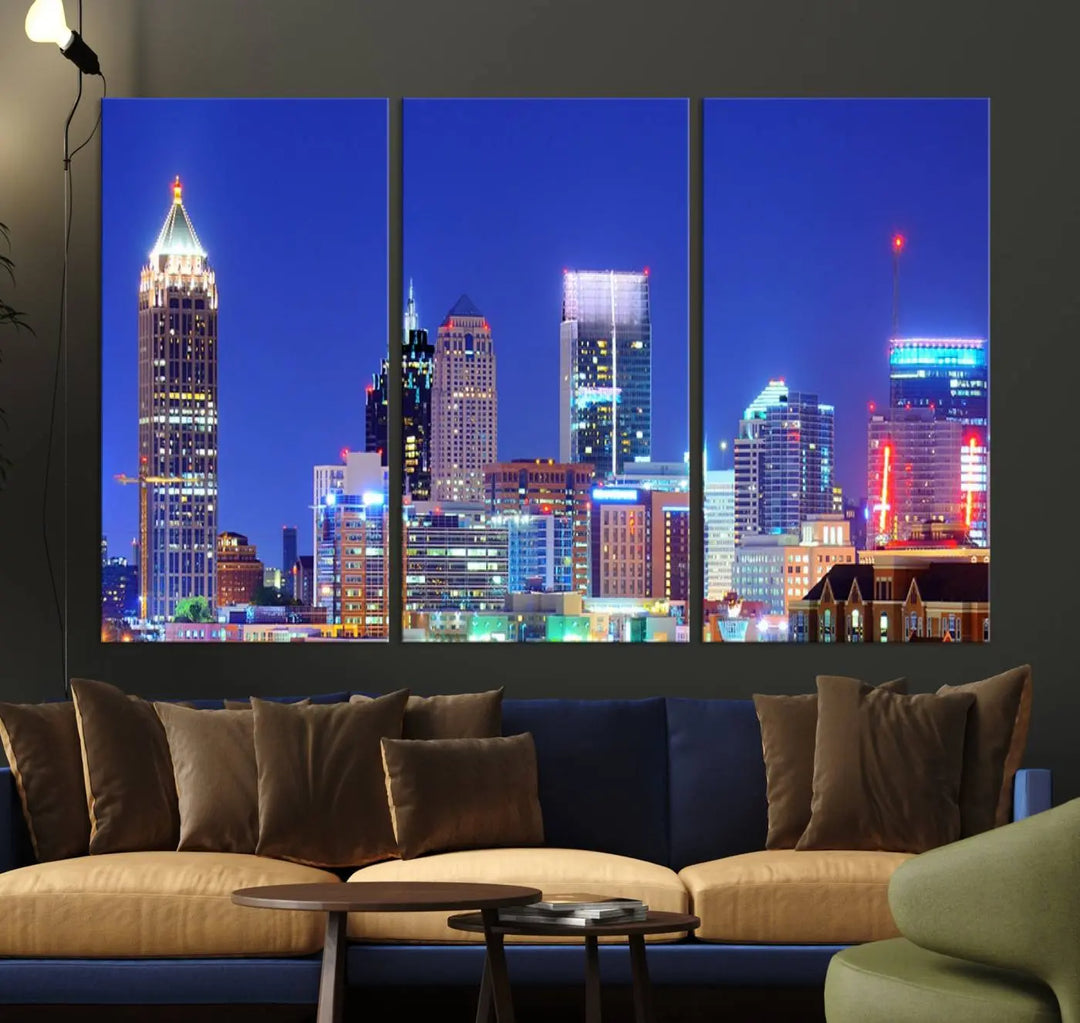 The modern living room is enhanced by the elegance of the "Atlanta City Lights Night Blue Skyline Cityscape Wall Art Canvas Print." This triptych, crafted on museum-quality canvas with a UV-protective coating, arrives ready to hang on the wall.