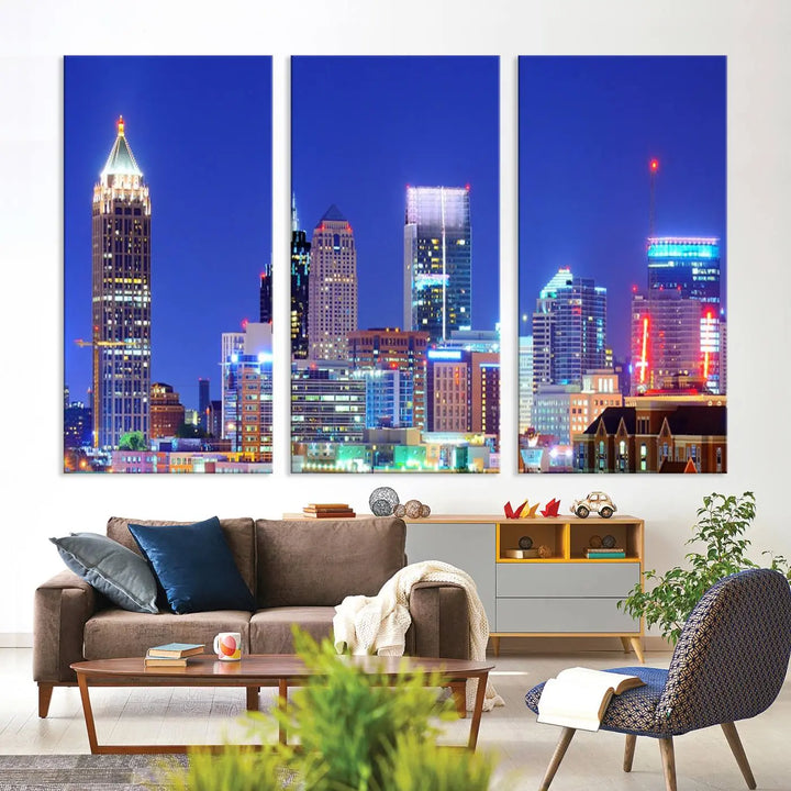 The modern living room is enhanced by the elegance of the "Atlanta City Lights Night Blue Skyline Cityscape Wall Art Canvas Print." This triptych, crafted on museum-quality canvas with a UV-protective coating, arrives ready to hang on the wall.