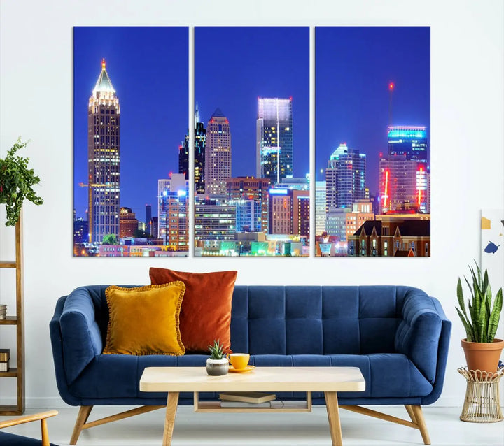 The modern living room is enhanced by the elegance of the "Atlanta City Lights Night Blue Skyline Cityscape Wall Art Canvas Print." This triptych, crafted on museum-quality canvas with a UV-protective coating, arrives ready to hang on the wall.