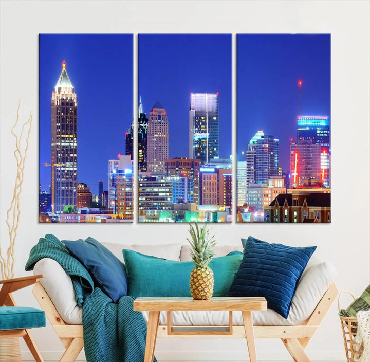 The modern living room is enhanced by the elegance of the "Atlanta City Lights Night Blue Skyline Cityscape Wall Art Canvas Print." This triptych, crafted on museum-quality canvas with a UV-protective coating, arrives ready to hang on the wall.